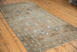 Distressed Belouch runner showing visible knot heads and unique geometric gul motifs.