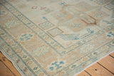 Hand-knotted Afghani Caucasian rug corner, with turquoise geometric bird motifs.