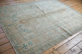 Original side cord selvage and geometric turquoise blue patterns on the Afghani carpet corner.