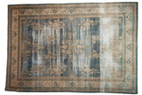 Distressed vintage Oushak carpet featuring faded blue and antique ivory floral sprays, 8'5