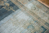 Distressed dark ocean blue and ivory floral sprays with visible knot heads.
