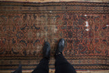 Vintage Hamadan rug runner showing allover Herati motif, blush, blue, and visible foundation wear.
