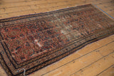 Vintage Hamadan runner detail: mostly even wear, exposed foundation, and meandering vine borders.