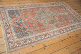 Distressed terra cotta field with faded beige geometric and vinery border details.
