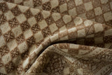 Heavily abrashed vintage Oushak rug with distressed diamond lattice and floral guls.