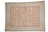 Distressed Vintage Oushak rug, blush and ivory with dusty blue primitive floral vinery.