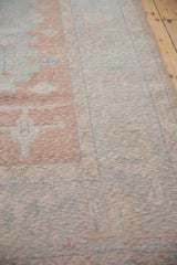 Distressed Oushak carpet section with soft blush, blue, ivory colors and foundation showing through.