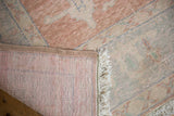 Distressed Oushak carpet corner, mostly even wear across knot heads with hand-knotted foundation.
