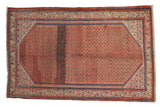 Vintage hand-knotted Mir Sarouk rug, madder red allover plant motif, abrashes, blue Serbend border.