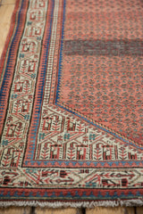 Vintage Mir Sarouk rug corner with Serbend vine and pawn borders in madder red and indigo.