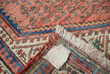 Vintage Persian Mir Sarouk rug detail showing hand-knotted foundation, fringe, and patterned pile.