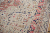 Evenly worn hand-knotted pile of a vintage Turkish Oushak rug in blush, beige and blue tones.