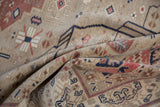Softly draped vintage Oushak carpet showing the even wear and low, hand-knotted pile.