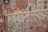 Hand-knotted reverse weave and intact side selvage of a distressed vintage Oushak rug.