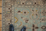 Detail of the low, even pile on a vintage Hamadan rug with seafoam green and sand geometric palmettes.