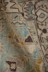 Detailed view of the softly worn pile on a vintage Hamadan rug with seafoam and gold motifs.