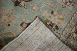 Reverse view of the Hamadan rug's corner, detailing the hand-knotted weave and secured selvage.