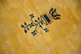 Dark blue pictorial potted plant motif on saffron yellow Peking carpet with pile variation.