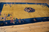 Nichols Art Deco rug corner: cobalt blue border, saffron field, floral, butterfly motifs.
