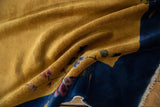 Textured saffron yellow field, cobalt blue border, and blush floral Art Deco vinery.