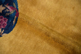 Saffron yellow pile texture of Art Deco rug, showing cobalt blue pictorial florals.