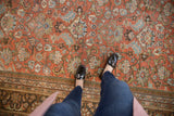 Distressed vintage Mahal carpet, allover floral vinery in terra cotta, blue, and ivory.