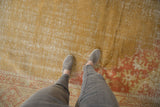 Saffron textured field of vintage Oushak carpet, with a pale terra cotta border.