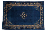 Vintage Peking carpet, indigo field, delicate floral medallion, pictorial border, 6' x 8'9