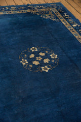 Textured indigo blue pile of the vintage Peking carpet, showing subtle speckling.