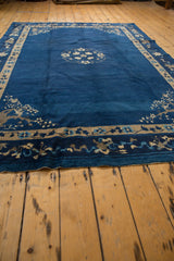 Vintage Peking carpet lower border with pictorial floral motifs and pale blue speckled wefting.