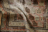 Textured Malayer runner showing worn boteh patterns, exposed foundation, and copper tones.