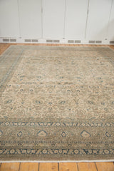 Vintage distressed Sivas carpet with soft curvilinear vinery in muted ivory, blue, and mauve.
