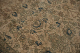 Curvilinear scrolling vinery and indigo floral motifs on a distressed Sivas rug.