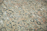 Distressed vintage Arak rug, showing mostly even wear, isolated foundation, and muted floral motifs.