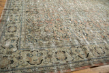 Vintage distressed Arak carpet, with artfully faded blush, ivory, and blue floral patterns.