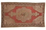 Vintage distressed Oushak rug with oversize blush medallion, Rococo leaves, and antique ivory, 4'5