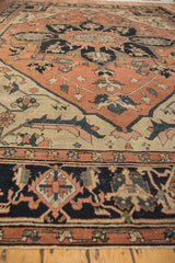 Antique Serapi carpet border with navy blue geometric patterns and soft terra cotta, ivory florals.