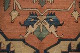 Hand-knotted antique Serapi rug detail: geometric floral cross-section in terra cotta, blue, green.