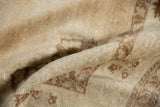 Distressed Oushak rug texture, antique ivory and coffee brown, with even wear.