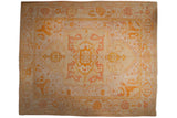 Antique Oushak carpet with central floral medallion, rich saffron, blush patterns, 11'1