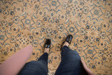 Vintage Mahal carpet texture, featuring Herati motif in muted beige, blue, and brown.