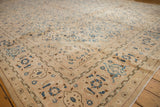 Mahal rug border corner, intricate Herati and samovar patterns in muted beige and blue.