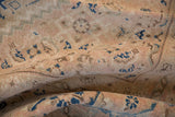Herati motif detail of vintage Mahal carpet in antique ivory, indigo blue, and coffee brown.