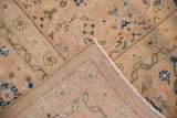 Mahal carpet's tightly woven foundation, light fringe, and beige and blue Herati motif pile.