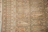 Distressed Sivas carpet with muted silver, ivory, terra cotta germinating plant pattern.