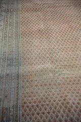 Distressed vintage Mir Sarouk rug, abrash, beige field, terra cotta boteh pattern, multi-hued border.