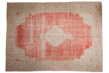 Distressed vintage Oushak carpet in faded cherry red and ivory with a large scalloped central medallion.