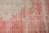 Mostly even wear across the knot heads of the distressed cherry red and ivory pile.
