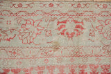 Detail of mostly even wear across the hand-knotted pile of a distressed vintage Oushak.