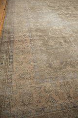 Muted floral vinery and distressed wear on vintage Sparta carpet's side selvage.